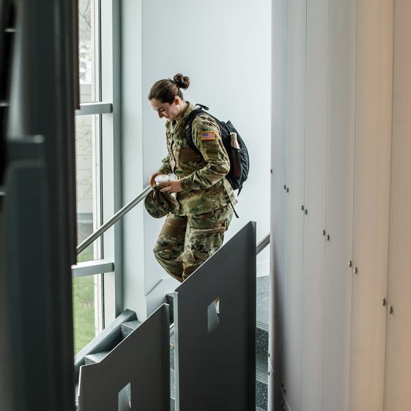 girl in army uniform in the library